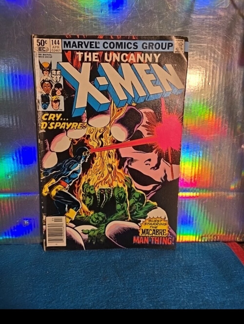 052526 UNCANNY XMEN #144 GUEST STARRING MAN-THING 1981 NEWSSTAND sleeved. Black